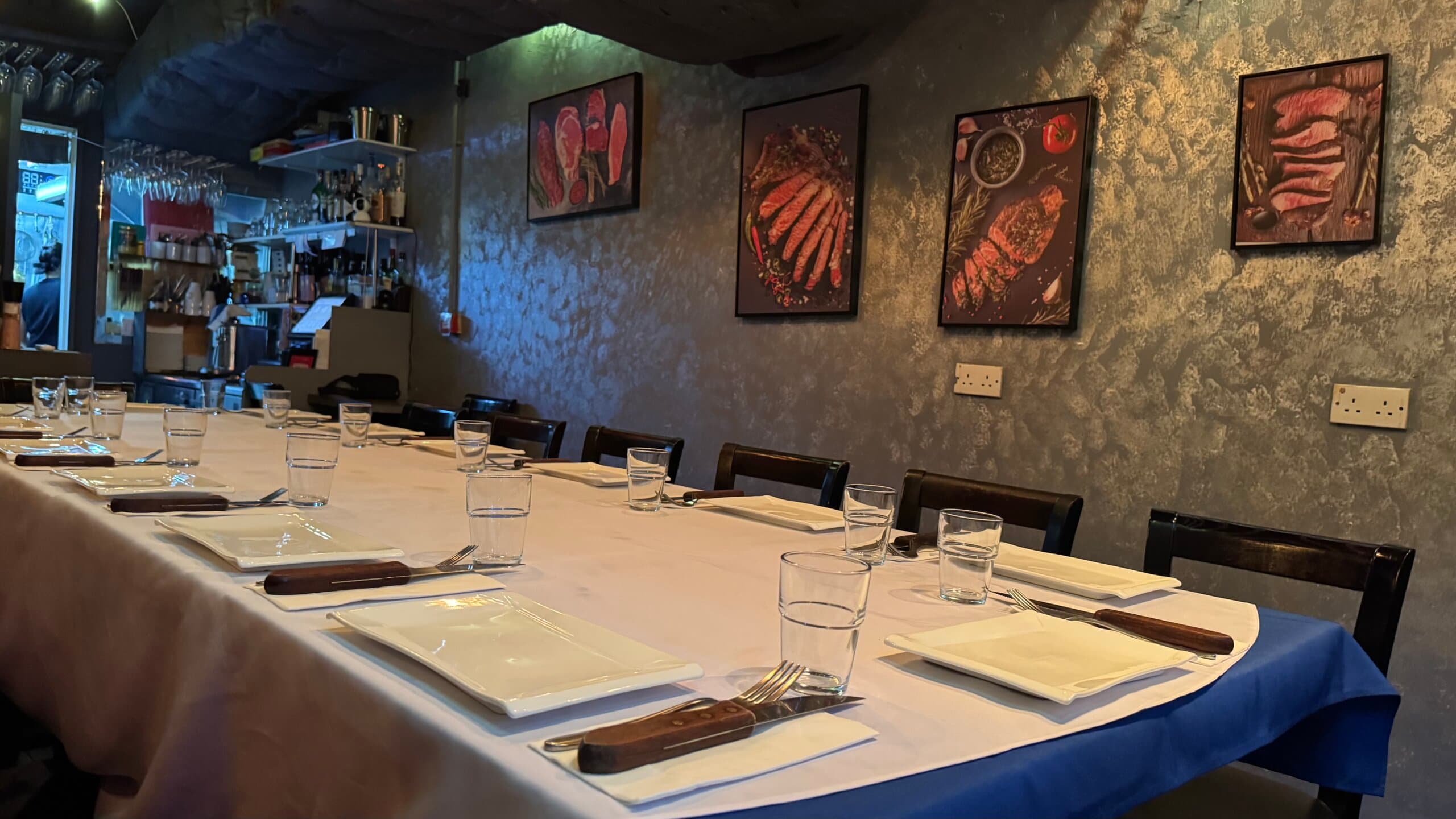 A long table set for a private group at The Den
